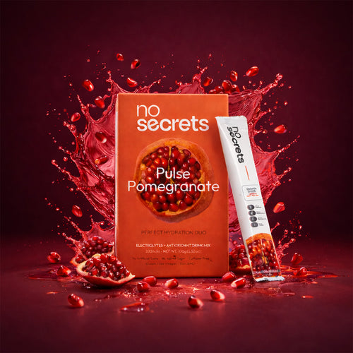 no secrets Pulse Pomegranate drink package with pomegranate seeds on a red background