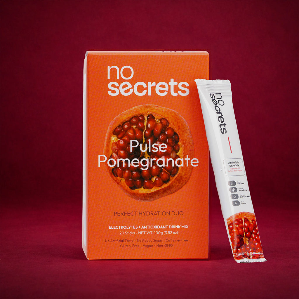 no secrets Pulse Pomegranate drink mix packaging on a red background