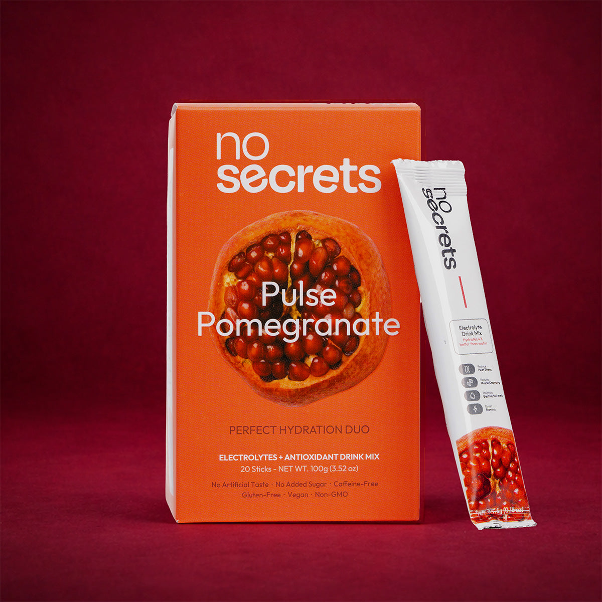 no secrets Pulse Pomegranate drink mix packaging on a red background